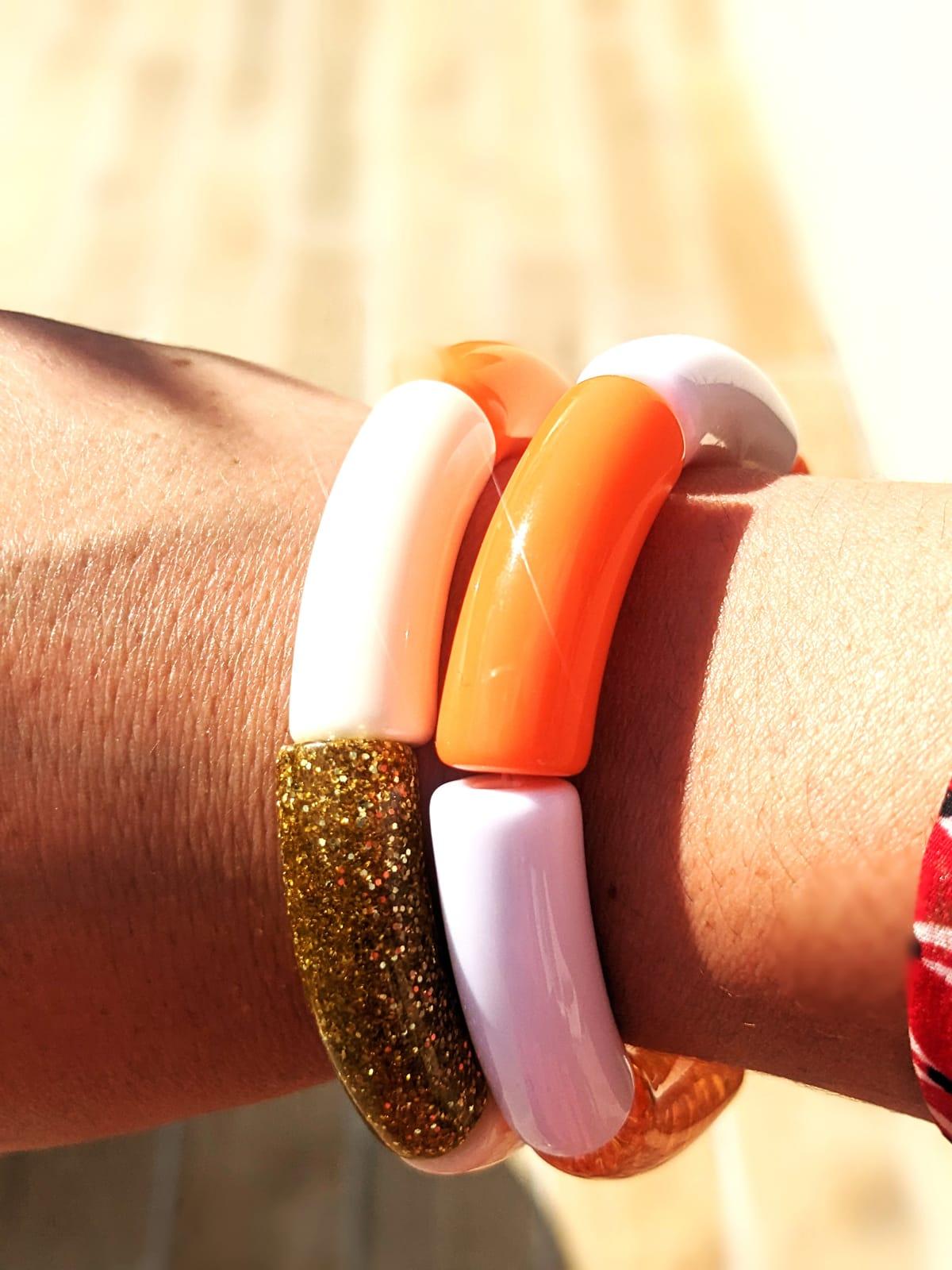 Bracelets Les p'tits Louls portés au coucher du soleil